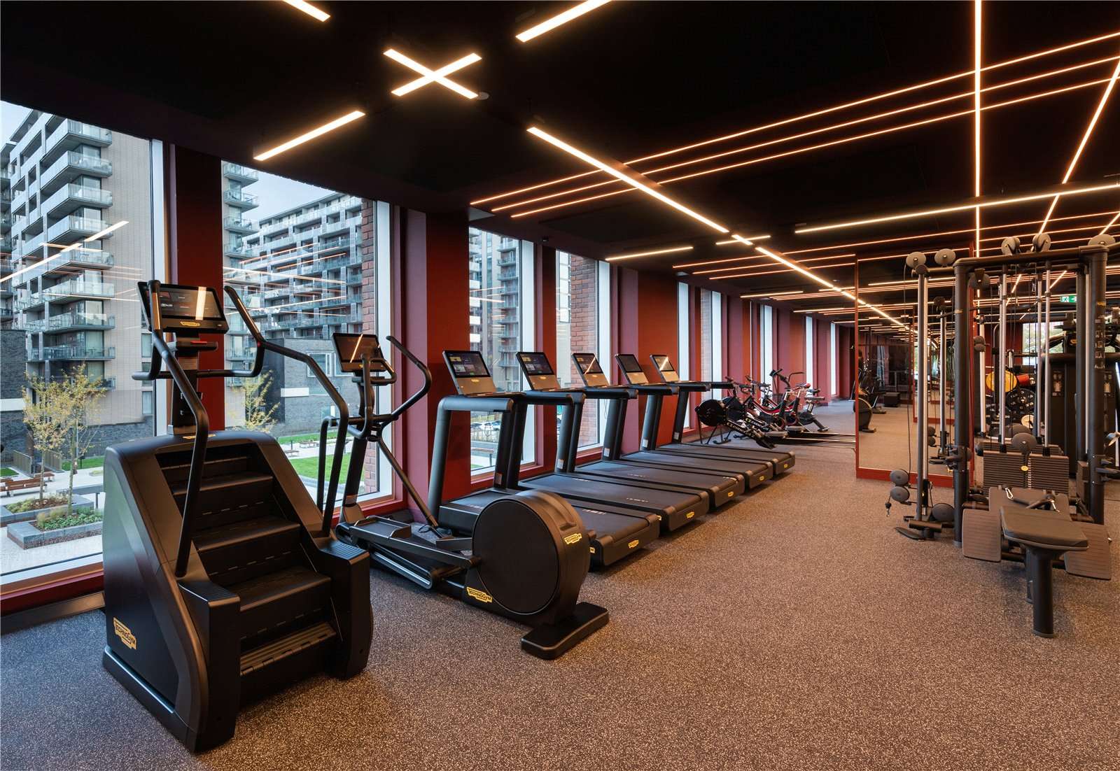 Gym with treadmills, cross trainer, stairs machine and strength equipment