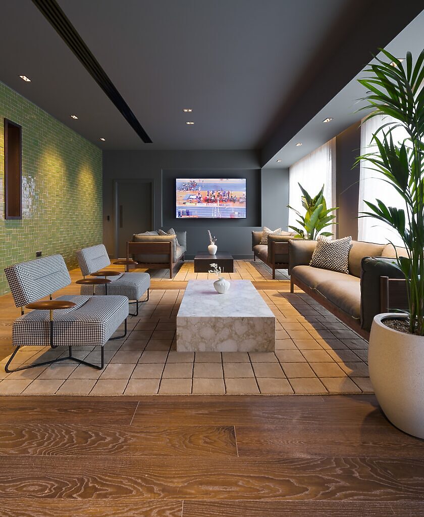 Lounge with patterned armchairs, a sofa, a marble coffee table and a wall-mounted screen
