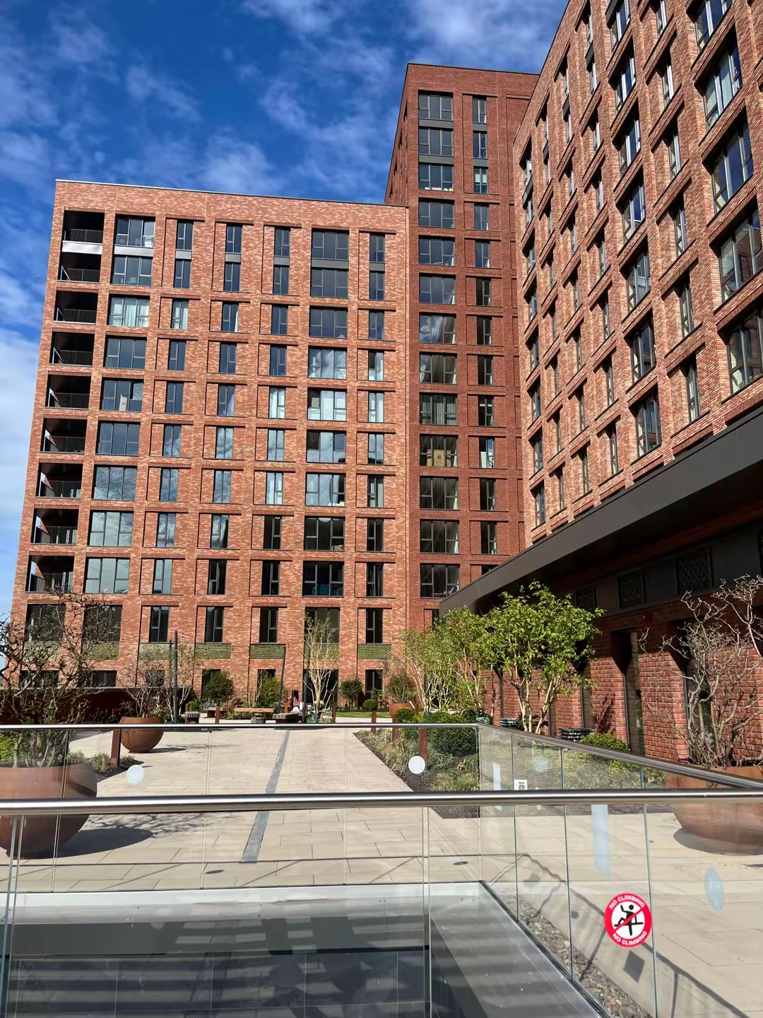 Waterhouse Gardens brick buildings surrounding a landscaped courtyard