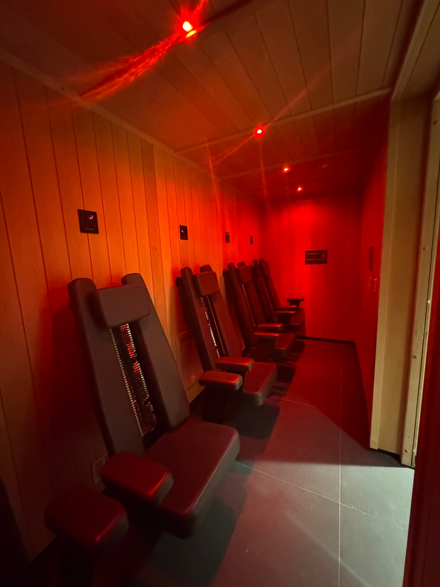 Infra-red sauna with heated seating and red ambient lighting